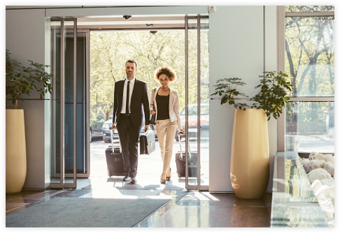 business partners walking thorough a lobby